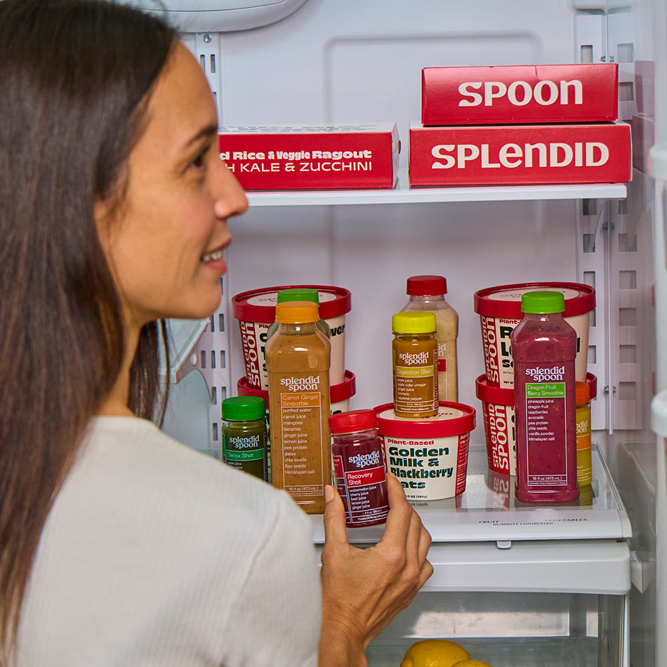 Woman looking at Splendid brand products in a refrigerator.