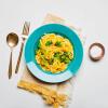Creamy butternut squash noodles on a plate with a napkin.