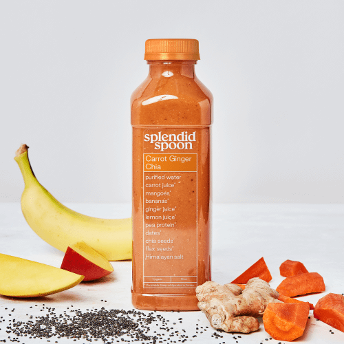 Carrot Ginger Chia Smoothie on white background with banana, mango, ginger, carrot and chia seeds.