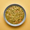 Gray bowl of Green Split Pea Soup on yellow background.