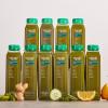 The Lower Sugar Green Juice Bundle - 10 bottles of Super Greens Juice stacked in a pyramid on a table