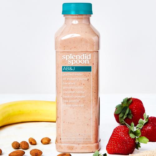 Banana, almonds, strawberries, baobab powder, bottle of abj smoothie on white background. 